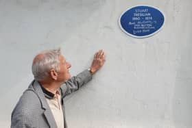 Trevor Goosey admires the 'blue plaque' mounted in honour of artist Stuart Tresilian