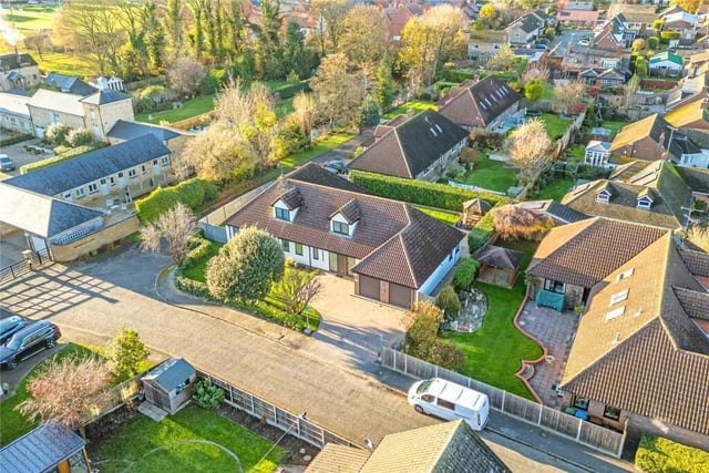 This house has a double garage, driveway and private garden.