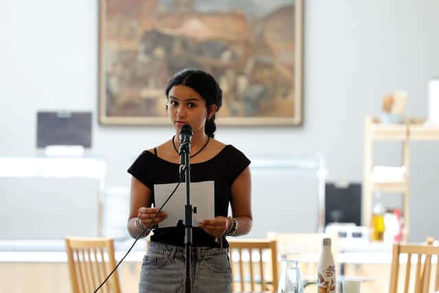 Priya Floura reading her winning essay