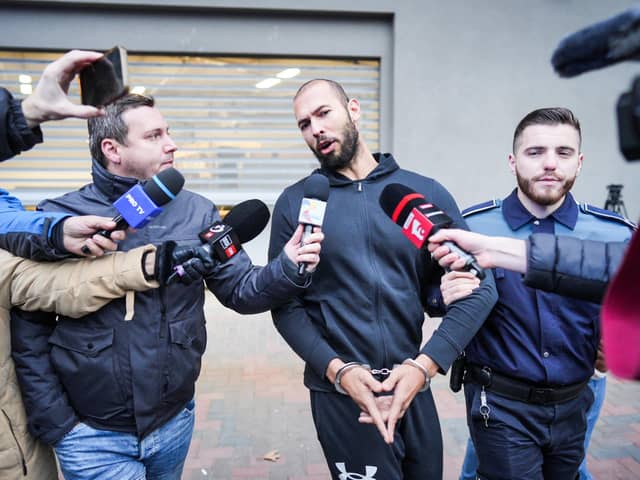 According to one poll, more than a quarter of young men have a favourable opinion of social media misogynist Andrew Tate, currently under house arrest in Romania amid an investigation into human trafficking (Picture: Mihai Barbu/AFP via Getty Images)