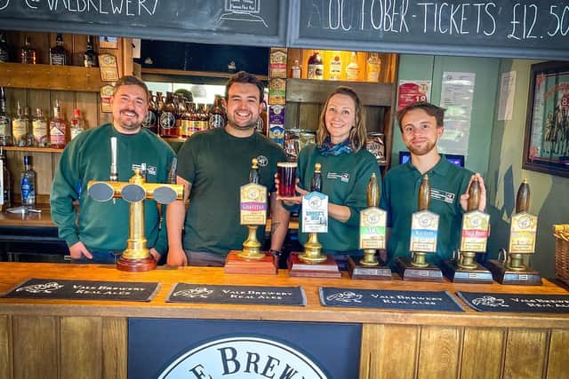 From left: David Sheffield of BBOWT, Huw Davies of Vale Brewery and Victoria Bentiba and Rob Cooke from BBOWT with a pint of Brock’s Den at the Vale Brewery bar.