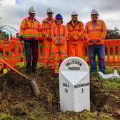 The reinstated milepost with, from left: Peter Strachan (Cabinet Member for Planning & Regeneration), Calvin Richardson (Area Manager, Transport for Bucks), Lucy Lawrence (Archaeological Officer), Eliza Alqassar (Historic & Built Environment Manager) and David King (Deputy Cabinet Member for Transport)
