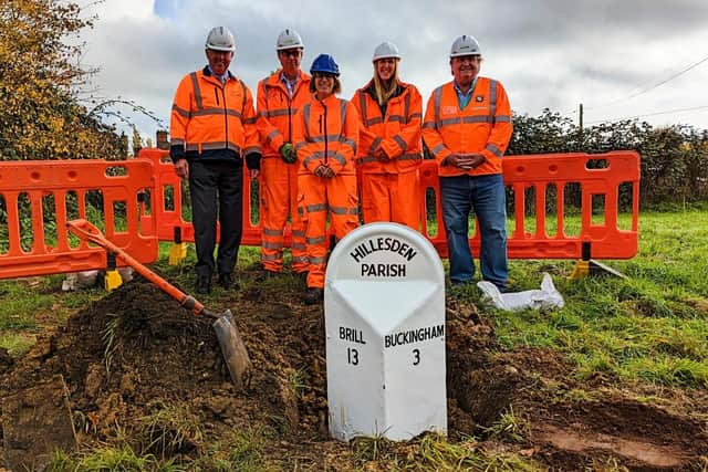 The reinstated milepost with, from left: Peter Strachan (Cabinet Member for Planning & Regeneration), Calvin Richardson (Area Manager, Transport for Bucks), Lucy Lawrence (Archaeological Officer), Eliza Alqassar (Historic & Built Environment Manager) and David King (Deputy Cabinet Member for Transport)