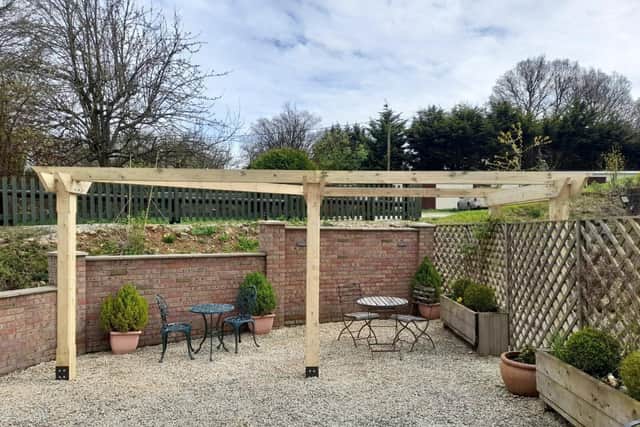 The pergola for Chilterns Dog Rescue Society, installed by Cala Homes