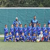 Stoke Mandeville Junior FC, under 7s Bucks and Stags sporting their new kit with Volunteer Coaches Liam, Marcus and Carl