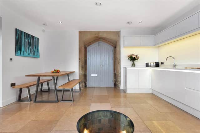 Bespoke American oak doors open into the living-dining kitchen, which features a special panel in the floor. (Picture: Rightmove)