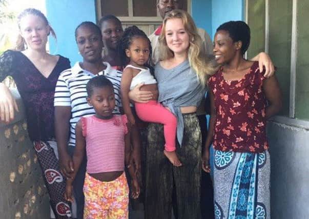 Mila Fenton O'Creevy (grey T-shirt) pictured during her trip to Tanzania
