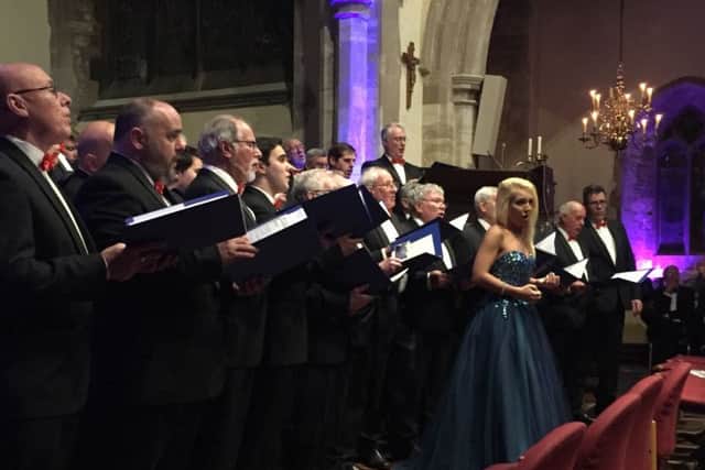 The choir and soloists performing