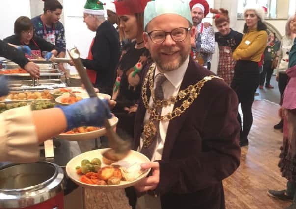 Aylesbury mayor Tom Hunter-Watts is served his Christmas dinner!