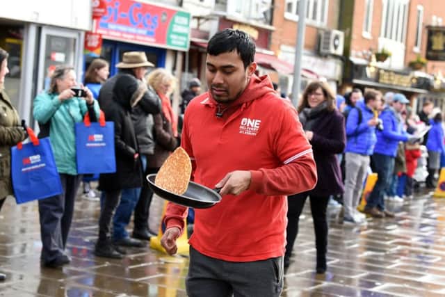 Action from this year's Mix 96 pancake race