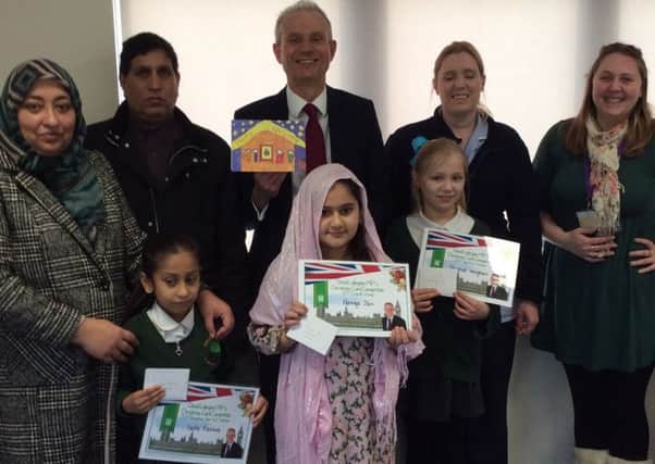 Pupils from Oak Green School celebrate their success in David Lidington MP's annual Christmas card competition