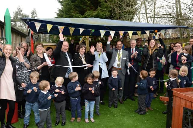 Winslow Combined School Early Years Foundation Stage 1 new Learning Environment grand opening. Jodie Griffiths, Early Years Commissioning Officer with Bucks County Council and Arif Hussain, Deputy Cabinet Minister EYFS with pupil, Finley Cumming, cut the ribbon accompanied by guests, parents, staff and children.