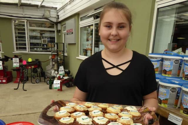 Rebecca's daughter Mia with her cakes