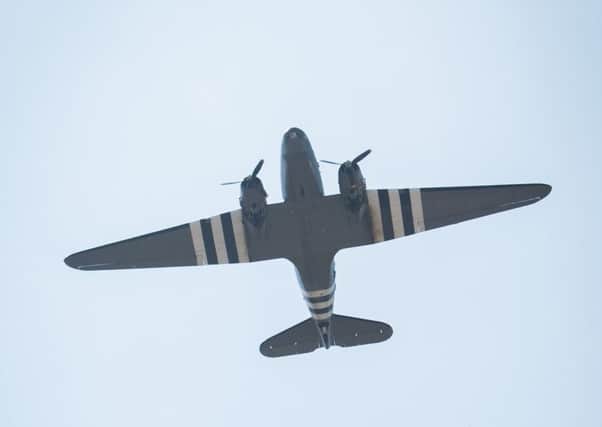 Library image - A plane makes a flypast during an event organised in association with RAF Halton