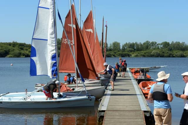 Great Moor Sailing Club, near Calvert, open day. Visitors try out sailing with club instructors. PNL-180630-174953009