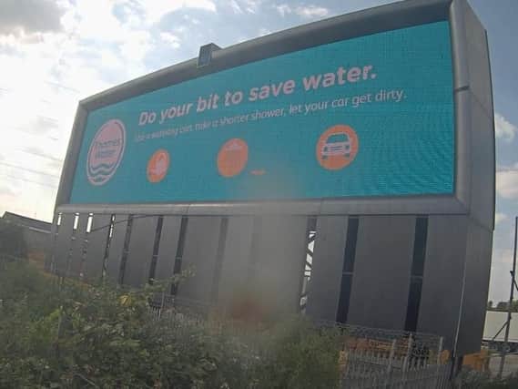 A Thames Water warning board at the side of a motorway