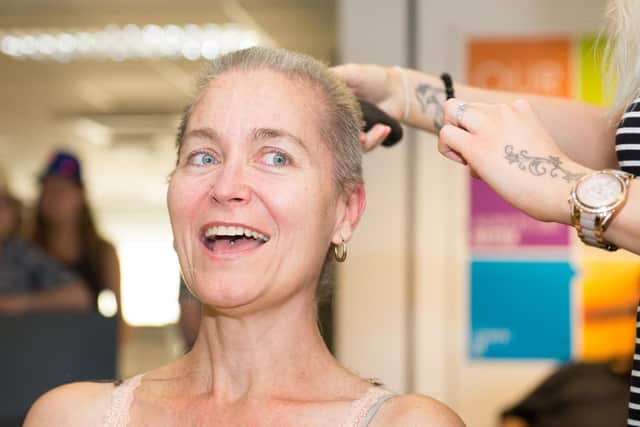 Elise Rawlings from Zen Hair Design did the honours - and shaved Catherine's head at Cosine's morning meeting today