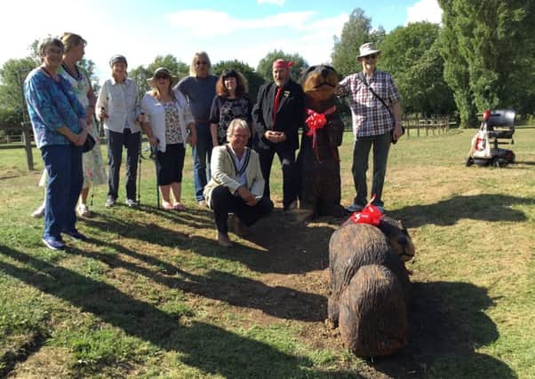 Buckingham residents and park users pose with the new otters