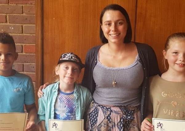 Project leader Georgia Bowers (pink top) with three young carers