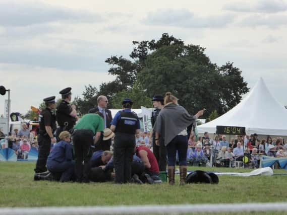 A police officer who fell off her horse at the Bucks County Show yesterday receives treatment