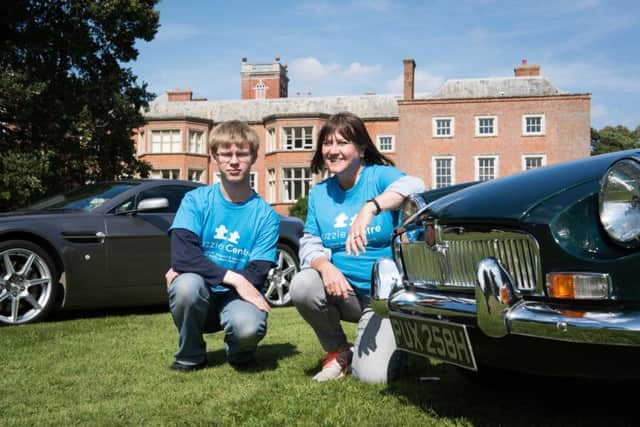 Cars In The Claydons, held at Claydon House - pictured are Clare Samways from the Puzzle Centre with volunteer Andrew Zimmerman PNL-180309-103203009