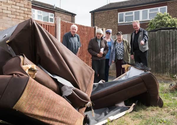 Prebendal Farm estate in Aylesbury - according to residents has become the 'forgotten estate' - paths in a mess, rubbish dumped and not cleared up, general disrepair - Alan Howard (pictured left) with residents
