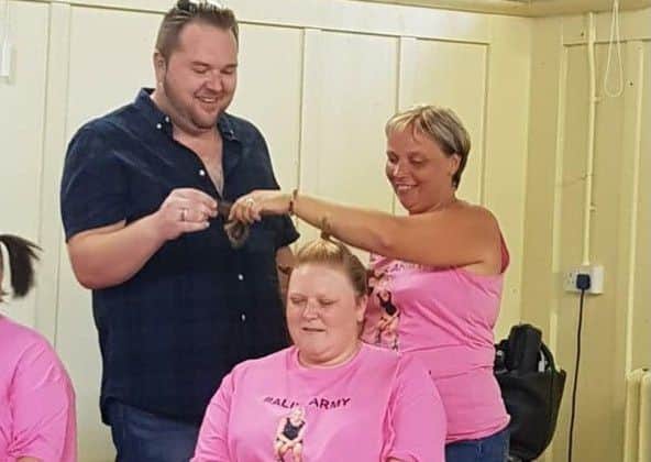 Laura Towse having her hair cut by Alison Fedoriw and Graeme Elder