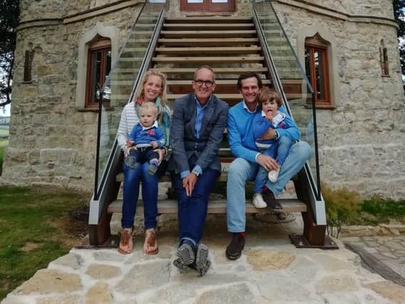 The Fernandez family with Grand Designs presenter Kevin McCloud