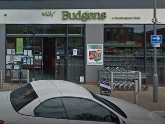 Men with "bladed" weapons steal a bottle of vodka from Buckingham Park Budgens