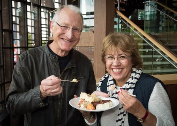 Aylesbury estate agents and solicitors bake off for Florence Nightingale Hospice, at Aylesbury Waterside Theatre - pictured are Peter and Zava Buggy sampling some of the delights