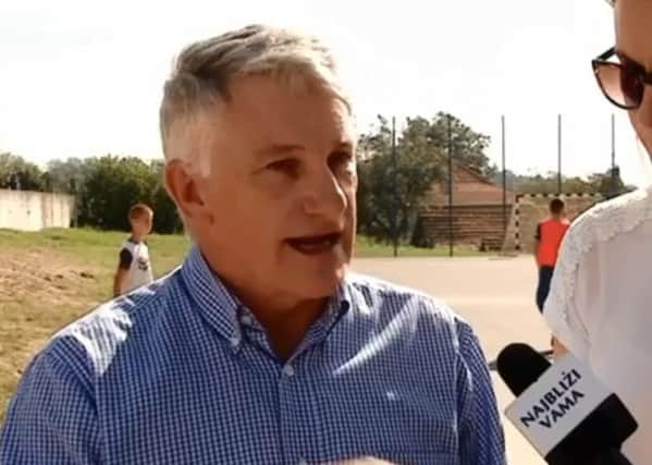 Brian Dipple speaking to Bosnian television at the site of the new sports area
