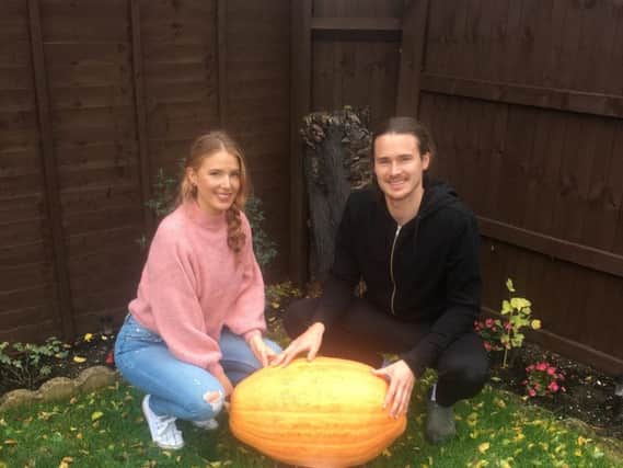 Nicole Lawrence and her partner Carl Moreton with the pumpkin, which they have named Peter