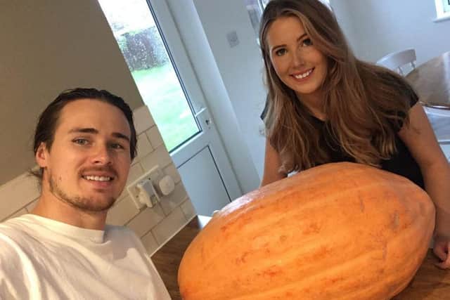 Nicole Lawrence and her partner Carl Moreton with the pumpkin, which they have named Peter
