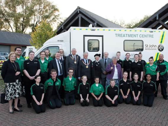 St John Ambulance volunteers and treatment centre vehicle