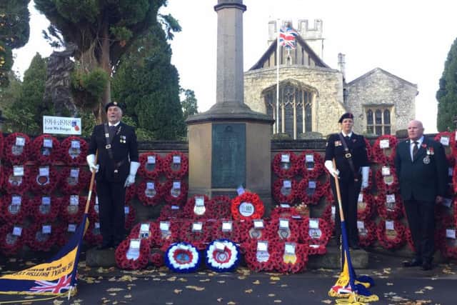 Winslow Royal British Legion Standard Bearers at War Memorial with 51 wreaths for the fallen