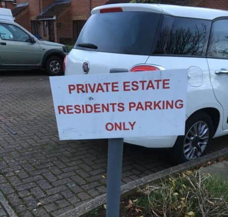 A clearly visible sign indicating parking is for residents only which is regularly ignored by some parents