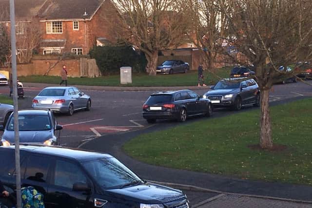 A general view of the parking chaos outside Bourton Meadow Academy