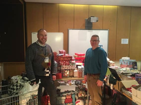 Bucks county councillors Paul Irwin and Mark Shaw with some of the many thousands of donated presents