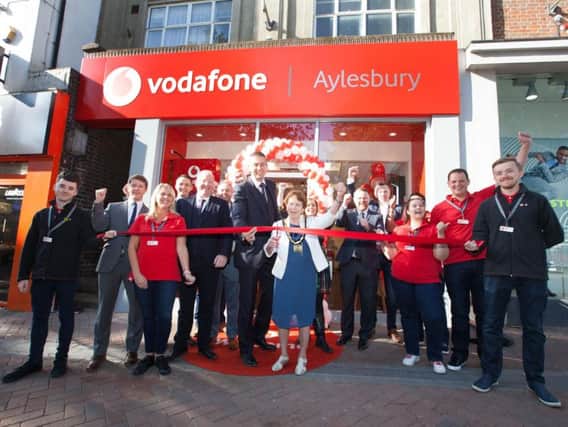 Staff from Aylesbury Youth Concern and Vodafone pictured outside the Vodafone store in Aylesbury