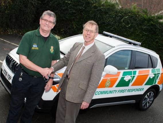Steve Acton (left) and Roger Jefcoate pictured next to the Winslow community first responder vehicle