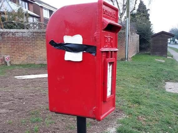 A slice of bread attached to a postbox on High Street South using duct-tape - this appears to be related to a new online craze