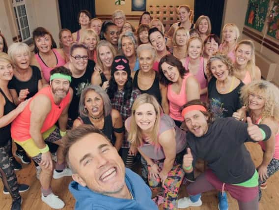 Catherine got the surprise of her life when the band popped in to take part in her dance class and her experience has now been turned into a primetime TV advert.