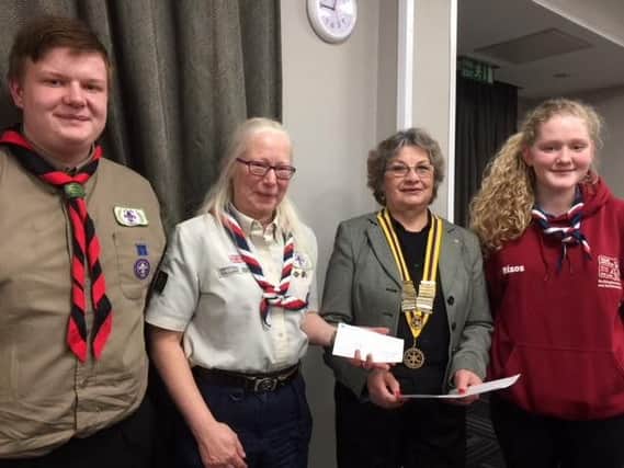 Money raised from the Rotary Club of Aylesbury cheque presentation is donated to representatives from the 1st Aylesbury Guides