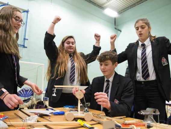 Members of the Cottesloe School team celebrate as their design appears to work successfully