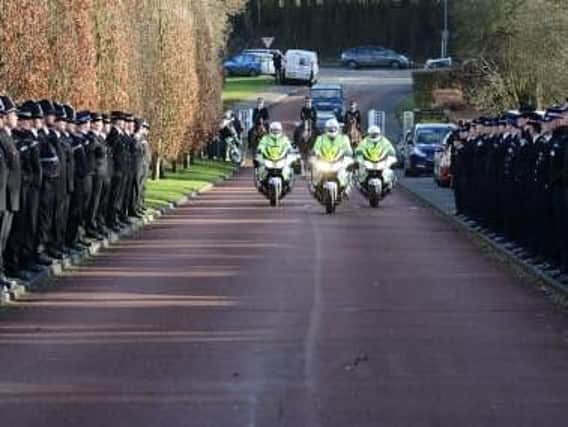 A funeral cortege in memory of PC Kevin Flint makes its way through the streets of Amersham