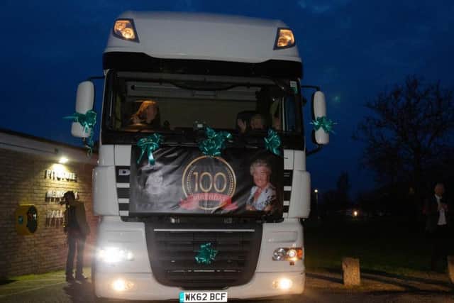 Kitty Pinnock arrives at her 100th birthday in the cab of a lorry