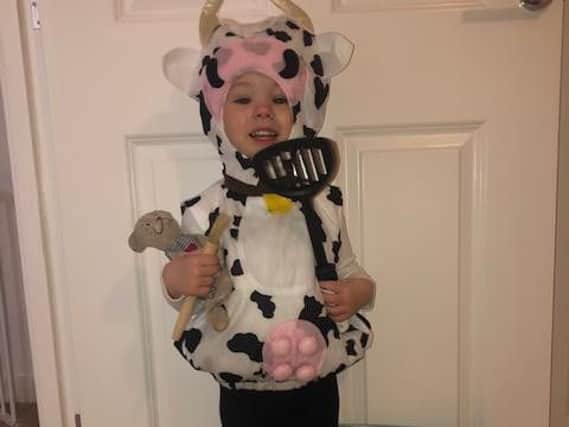 Roseanna Holmes, two and a half, who attends Little Ridges Nursery, Aylesbury, dressed as Cow from Cows in the Kitchen by June Crebbin