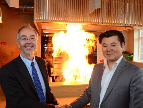Bucks County Council leader Martin Tett and owner Kelvin Wong celebrate the opening of MIYA's new Japanese grill and bar