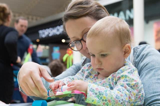 There was fun for everyone at the Friars Square family fete last week - here one-year-old Nina Nevin enjoys some crafty fun with her mum