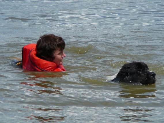 Fiona Daniels gets rescued by a Newfoundland from Watermead Lake during a previous Take the Plunge event